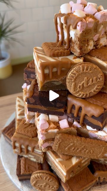 Big Bakes Bakery on Instagram: "Biscoff Brownie Tower  There are 2 size options to choose from:  ‘The small’ is made up of 38 nibble portions for £57  ‘The large’ is made up of 65 nibble portions for £96  There’s 6 flavour options to choose from 🤎Choc (Brownie, billionaires flapjack, Oreo brookie) 🤎White choc (Brownie, Milky Bar blondie, Milky bar millionaires cookie)  🤎Biscoff (Biscoff brownie, Biscoff millionaires cookie, Biscoff Rocky road) 🤎Caramel (Caramel brookie, Caramel Blockie and brownie) 🤎Kinder/Nutella (Kinder brownie, Kinder millionaires cookie, Nutella Blondie) 🤎Birthday sprinkles (Sprinkles millionaires’ cookie, sprinkles blondie, sprinkles blockie)  To order: email bigbakesbakery@hotmail.com with your details - including your date, size and flavour Limited availabilit Biscoff Millionaires, Brownie Cake Birthday, Oreo Brookie, Brownie Tower, Biscoff Rocky Road, Nutella Blondies, Cookie Sprinkles, Milky Bar, Best Brownies