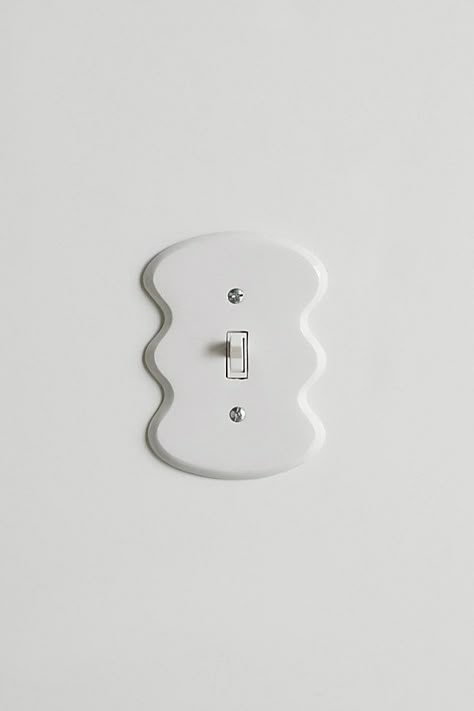 Squiggly switch plate from UO home made to cover a standard rocker switch. Cast from aluminum and painted by hand, each plate is unique and may vary slightly from piece to piece. Find it only at UO. Content + Care 100% Aluminum Wipe clean Imported Size Dimensions: 3.75" x 0.25" x 5" Weight: .04lbs | Maura Light Switch Cover in White at Urban Outfitters Colorful Light Switch Covers, Modern Light Switch Covers, Funky Light Switch Covers, Polymer Clay Light Switch Cover, Cute Light Switch Covers, Painting Outlets, Charleston Apartment, La Bedroom, Black Light Switch