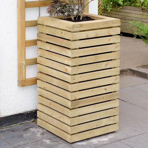 The tall contemporary Planter is a robust tall Planter which compliments the Grange contemporary range. It is ready to be planted immediately. The Planter can be used as a pair to an entrance or a walkway or even as a standalone feature and perfect for topiary and acer trees. The planed and rounded slats are pressure treated green for a high quality finish and an extra decorative look. Timber Planters, Decorative Trellis, Cheap Plants, Wooden Trellis, Contemporary Planters, Treated Timber, Planter Design, Tall Planters, Planter Pots Outdoor