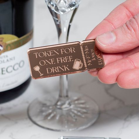 These fun drinks tokens are a great addition to your wedding reception to hand out for your guests to enjoy a free drink from the bar. These tokens make planning your drink allocation on the day easy and are a fun accessory to the wedding reception.  The retro tocket shaped tokens are engraved with the message 'TOKEN FOR ONE FREE DRINK' along with your names and wedding date for a personal touch. They can be make from either mirror acrylic in a choice of silver, rose gold or gold, or in natural Drink List, Wood Sample, Rose Gold Mirror, Rustic Theme, Acrylic Sign, Silver Mirrors, Party Accessories, Celebration Party, Wedding Favours