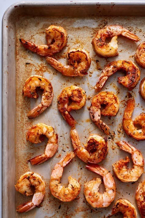 This cajun shrimp recipe is juicy and a tad spicy, but we're showing you how to cook this super easy shrimp dish from frozen. This frozen shrimp recipe requires kosher salt, garlic powder, paprika, ground pepper, onion powder, dried thyme, oregano, cayenne pepper, and extra-large peeled shrimp. Pre Cooked Shrimp Recipes, Whole30 Shrimp, Frozen Shrimp Recipes, Frozen Cooked Shrimp, Broiled Shrimp, Cooked Shrimp Recipes, Cooked Shrimp, Juicy Shrimp, Roasted Shrimp