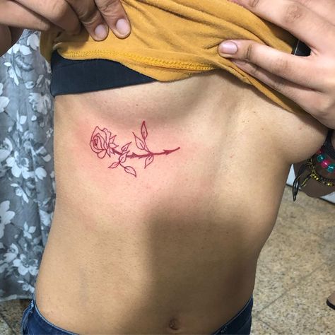 45 Sexy Underboob Tattoos You'll Want to Get ASAP Rose Tattoo Under Breast, Front Rib Tattoos For Women, Under Bobs Tattoos, Front Rib Tattoo, Underboob Tattoo Black Women, Under Breast Tattoos For Women, Rose Underboob Tattoo, Small Underboob Tattoo, Under Breast Tattoo