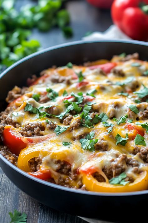 This Ground Beef Stuffed Pepper Skillet brims with all the traditional stuffed pepper flavors, but it's crafted in a single pan in under 30 minutes! Perfect for those busy weeknights, this dish is a quick and effortless dinner solution. Experience all the beloved flavors of classic stuffed peppers with this simple Stuffed Pepper Skillet recipe. Stuffed Peppers Ground Beef, Stuffed Pepper Skillet, Pepper Skillet, Stuffed Peppers Beef, Stuffed Pepper Casserole, Avocado Tomato Salad, Stuffed Pepper, Crowd Pleasing Recipes, Pasta Casserole