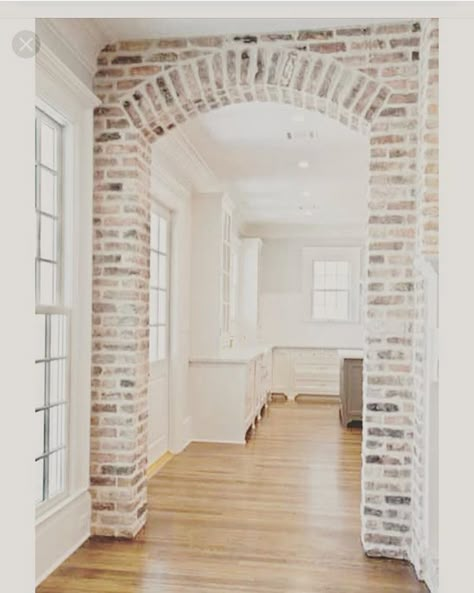 Stone Around Doorway, White Brick Archway, Brick Stairwell Interior, Interior Brick Accents, Brick Archway In Living Room, Bricked Archway, Brick Doorway Interior, Brick Arches Interior, Interior Brick Archway