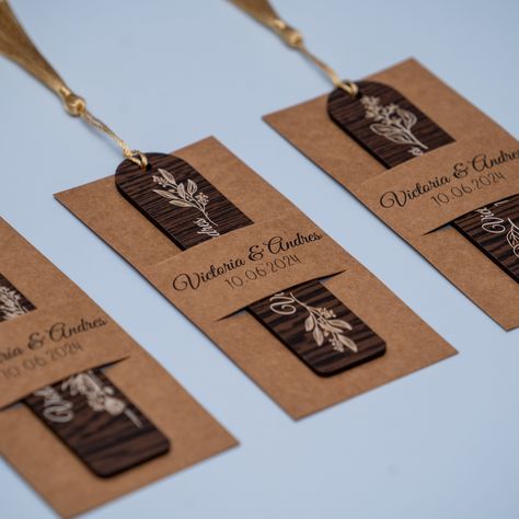 Enhance your wedding or special occasion with our handcrafted personalized wooden bookmarks. Each bookmark features a unique design, engraved with the names of the couple and the wedding date, making it a perfect keepsake for your guests. The bookmarks are adorned with a stylish tassel, adding a touch of elegance and functionality. Details: Material: High-quality wood Customization: Names and date can be engraved Designs: Choose from a variety of beautiful designs (see photos for options) Set In Laser Cut Wedding Favors, Wooden Bookmarks, Bookmark With Tassel, Unique Party Favors, Custom Wedding Favours, Laser Cut Wedding, Vendor Events, Rustic Bridal, Bridal Shower Rustic