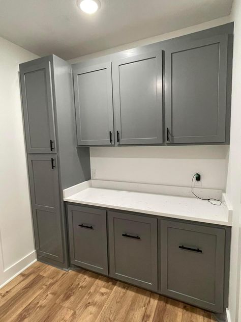 Laundry Room Folding Station Cabinets, Laundry Room Sewing Room Combo, Laundry Room Base Cabinets, Laundry Room Long Cabinet, Laundry Room Cabinet Layout, Laundry Room With Dark Floors, Laundry Room Cabinet Door Handles, Laundry Room Cabinets And Shelves Layout, Laundry Room Full Bathroom Combo