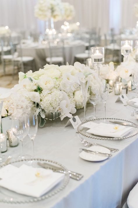 Pure White Wedding Decor, White And Grey Wedding Flowers, White Cream Ivory Wedding, Wedding Place Setting Silver, White Grey Wedding Decor, Silver Grey And White Wedding Theme, White Low Centerpiece Wedding, Silver And White Dessert Table, White And Silver Table Settings