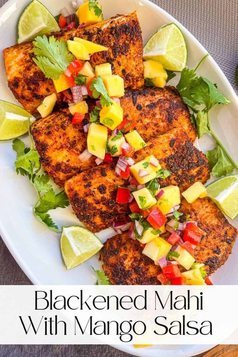 This easy Blackened Mahi Mahi with Mango Salsa is the restaurant-quality seafood dish you've been looking to add to your weekly menu. Use store-bought seasoning mix and salsa, or make your own with the easy ingredients included in the recipe card. No special skills or equipment involved - just a rockstar fish dinner at your own kitchen table. Pin this one to your favorite board today! Mahi Mahi Side Dishes, Magi Mahi Recipes, Mahi Recipes Baked, Mango Salsa Fish, Blackened Mahi Mahi Tacos, Mahi Mahi With Mango Salsa, Mahi Recipes, Blackened Mahi Mahi, Mango Habanero Salsa