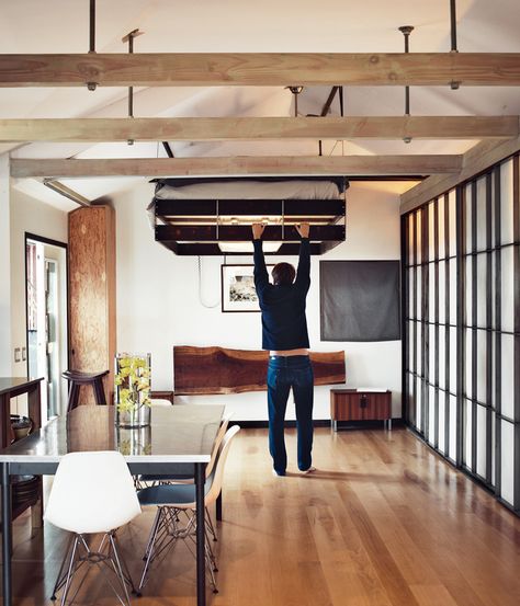 The bed pulls down from a nook in the ceiling--probably one of the most inventive, small-living tricks I've seen. Suspended Bed, Gift Towers, Murphy Bed Plans, Compact House, Tiny Apartments, Christmas Tradition, Space Interiors, Compact Living, Tiny Spaces