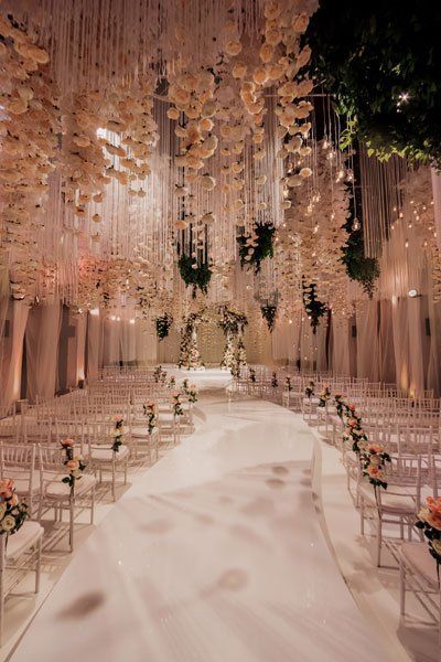 Who wouldn’t want to walk down the aisle underneath a breathtaking ceiling like this? A shower of blush florals transforms this ceremony into a romantic vision. Over The Top Wedding Bouquet, Beautiful Weddings Venues, Wedding Venue Beautiful, Gorgeous Wedding Venues Outside, Grand Wedding Venue Ideas, Elegant Boho Wedding Ceremony Decor, Cute Wedding Venues Inside, Kpop Wedding Theme, Top Wedding Venues In The Us