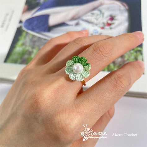 Onirr Micro Crochet Handmade Daisy Pearls Ring Let this hand-crocheted daisy ring accompany you in every delicate moment. It reveals the warmth of handicrafts and the pursuit of beauty, becoming a unique masterpiece that decorates your fingers. You can buy it in our store——onirr.com ------------------------------------------------------ #gift #handmadecrafts #crochet #handmadegifts #diygifts #handmade #microcrochet #girlsfashion #ring Daisy Earrings Crochet, Crochet With Pearls, Crochet Ring Patterns, Crocheted Daisy, Fabric Ring, Pearls Ring, Crochet Ring, Contemporary Handmade Jewelry, Micro Crochet