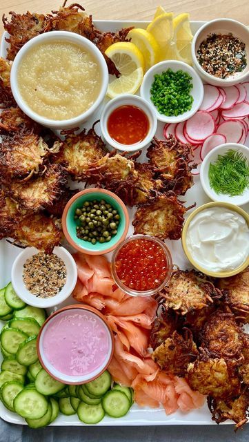 The Kitchn on Instagram: "Our Hanukkah plans? Making this latke board 😍😋 It’s a super fun and easy to celebrate the holiday that EVERYONE will love! Get @byrachelp’s latke tips and find out what’s not on her board at the link in bio! #thekitchn #hanukkah #latkes #latkeboard #latke #holidayhosting #holidayseason #holidayparty #holidayvibes" Potato Latke Board, Potato Latkes Board, Latke Charcuterie Board, Hannukah Food Ideas, Hanukkah Dinner Party, Hannukah Dinner Ideas, Latke Board, Chanukah Dinner, Hanukkah Appetizers