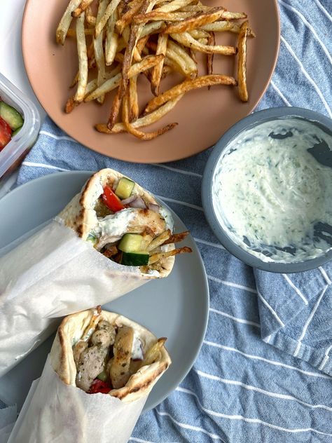 Greek Chicken Gyros - Coined Cuisine French Fry Recipe Baked, Greek Chicken Gyros, Lamb Gyros, Juicy Chicken Thighs, Homemade Tzatziki Sauce, French Fries Recipe, Crispy Fries, Homemade Tzatziki, Homemade French Fries