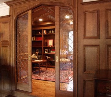 Tudor arch doorway with glass pocket doors - lovely Library With Pocket Doors, Tudor Arched Front Door, Pocket Doors Victorian, Tudor Style Interior Doors, Tudor Home Decor, Tudor Homes Interior Design, Arched Pocket Doors, Tudor Arch, Doors Decoration