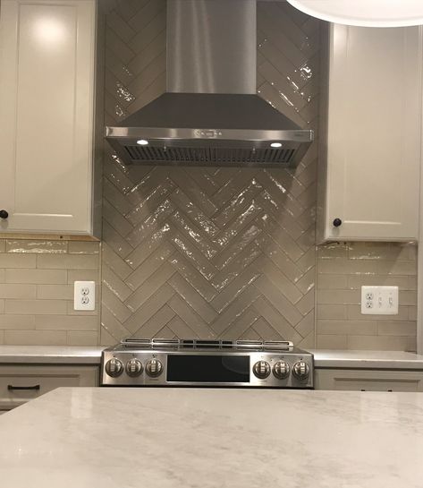 Subway Tile Herring Bone Pattern at Range Hood Herring Bone Tile Backsplash, Range Hood Backsplash Ideas, Tile Behind Range, Hood Backsplash, Kraftmaid Kitchens, Range Tile, Kitchen 2023, Bone Pattern, Subway Tile Backsplash Kitchen