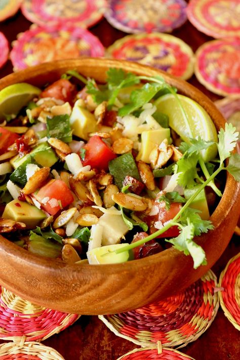 Chopped Mexican Salad with Spiced Pepitas has a Honey-Lime Chipotle Dressing and a hearty festival of fresh Mexican flavors. It's fantastic on its own or with almost any main course. Salad With Pepitas, Spiced Pepitas, Mexican Chopped Salad, Chipotle Dressing, Mexican Salad, Mexican Flavors, Mexican Salads, Honey Chipotle, Refreshing Salad