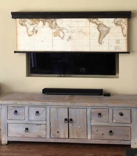 19 Stylish Ways of Cleverly Hiding a TV in a Living Room - Tiny Partments Diy Tv Box Wall Mount, Sliding Barn Door Tv Cover, Hide Tv On Wall Tv Covers, Picture Tv Cover Hidden Tv, Flat Screen Tv Above Fireplace, Pull Out Tv Hidden Tv, Camouflage Tv On Wall, Canvas Over Tv, Ways To Hide A Tv On The Wall