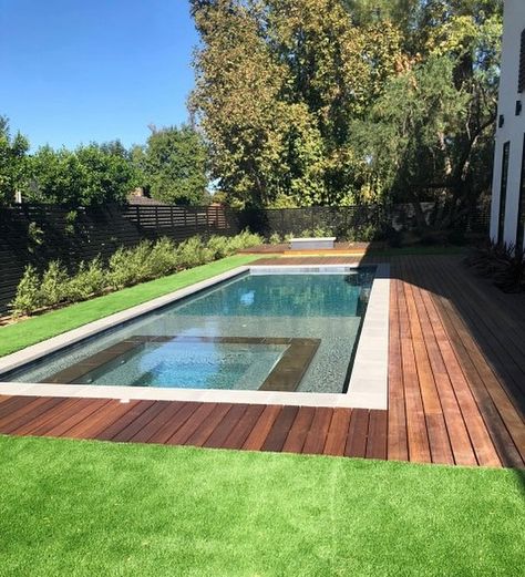 Excited to reveal one of our projects: brand new modern pool construction, lush turf, and a sleek wood deck for a beautiful home in Tarzana! 🌿🏡 Dive into modern elegance! #exodus #exodusremodeling #tarzana #luxury #pool #poolconstruction Wood Pool Deck, Luxury Pools Backyard, Outdoor Pool Area, Modern Pool, Rectangular Pool, Luxury Pools, Pool Construction, Modern Pools, Backyard Remodel