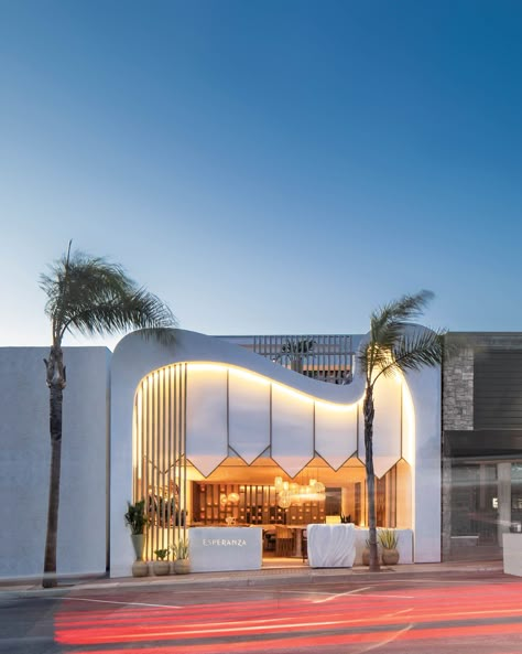 2021 Best of Year winner for Hospitality - Fine Dining. Los Angeles architectural designer Gulla Jónsdóttir has a thing for biomorphic shapes. In her latest hospitality project, the cresting stucco facade sparked by the white sand dunes of Los Cabos, Mexico, at Esperanza, a hip new Sonoran-style restaurant in Manhattan Beach that Jónsdóttir worked on via FaceTime from her native Iceland during the pandemic. Stucco Facade, White Sand Dunes, Restaurant Facade, Spanish Farmhouse, Manhattan Beach California, Mayfair Hotel, Manhattan Restaurants, Glamorous Interiors, Shop Facade