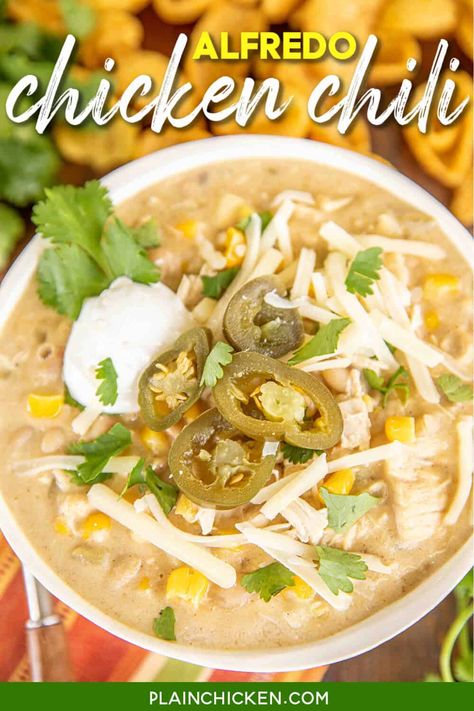 Alfredo Chicken Chili - seriously delicious and ready in under 30 minutes! Rotisserie chicken, white beans, corn, green chilies, chicken broth, onion, garlic, cumin, sour cream, Alfredo sauce, cayenne pepper, and pepper jack cheese. Top with extra sour cream, cheese, and jalapeños. Comfort food at its best! Can freeze leftovers for a quick meal later. #soup #mexican #chili #chicken #slowcooker #crockpot Chicken Alfredo Sauce Recipe, Chicken Slowcooker, Chicken Chili Recipe Easy, Freeze Leftovers, White Chicken Chili Recipe Crockpot, Southern Cornbread Recipe, Mexican Chopped Salad, Alfredo Chicken, Mexican Chili