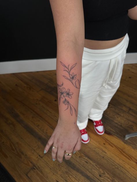 Flower Vine Tattoo Wrap Around, Daffodil Tattoo Wrap Around Wrist, Vine And Flower Wrap Tattoo, Women Flower Tattoos Arm, Vine Flower Arm Tattoo, Rap Around Flower Tattoo, Aster Flower Vine Tattoo, Violet Wrap Around Tattoo, Birth Flowers Vine Tattoo