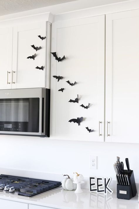 paper bats on kitchen cabinets in a white kitchen Paper Bats On Walls, Diy Family Costumes, Bats Halloween Decorations, Pumpkin Crafts Diy, Cheap Halloween Decor, Diy Halloween Party Decor, Diy Painted Pumpkins, Diy Pumpkin Crafts, Diy Pumpkin Decor