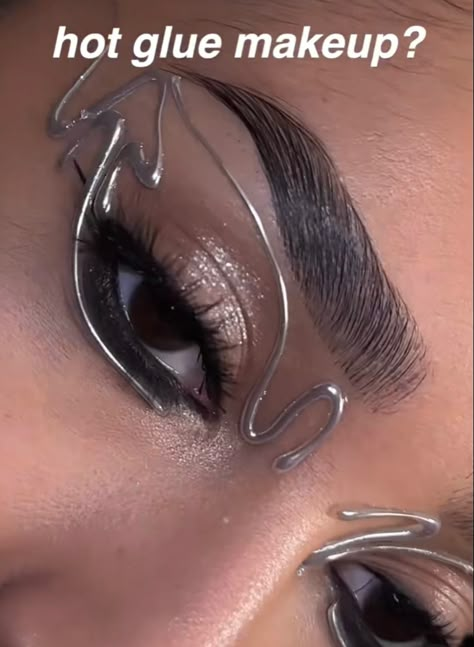 Makeup With Graphic Eyeliner, Silver Graphic Makeup, Hot Glue Eyeliner, Chain Eye Makeup, Hot Glue Eye Makeup, Hot Glue Makeup Looks, Silver Alien Makeup, Silver Graphic Liner, Silver Rhinestone Makeup