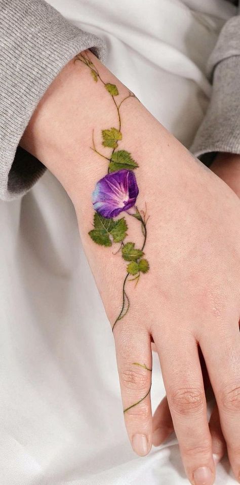 Elven Leaf Tattoo, Purple Vine Tattoo, Green Flowers Tattoo, Cute Coverup Tattoos, Wild Flower Hand Tattoo, Wildflower Ankle Tattoo Wrap Around, Stained Glass Flower Tattoo, Lavender Ankle Tattoo, Colorado Columbine Tattoo