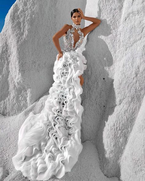 To acquire this exclusive Haute Couture Wedding Dress, reach out via DM. This enchanting gown epitomizes haute couture, combining dramatic design with superb craftsmanship. The dress showcases a form-fitting bodice embellished with delicate, hand-embroidered floral appliqués that gracefully extend over the shoulders and down the torso. These details create a striking contrast against the skin, highlighting the deep plunging neckline and enhancing the dress's captivating allure. A high halte... Embellished Corset, Black Floor Length Dress, Custom Made Dresses, Haute Couture Wedding Dress, Exquisite Gowns, Couture Wedding Gowns, Long Sleeve Gown, Mermaid Silhouette, Couture Wedding