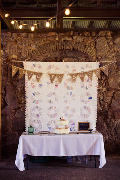 Love is sweet.california-ranch-wedding-travis-and-sarah Quilt Photo Backdrop, Quilt Backdrop Wedding, Quilt Backdrop, Fringe Garland, California Ranch Wedding, Southern Charm Wedding, Fall Ceremony, Bunting Wedding, Sweet California