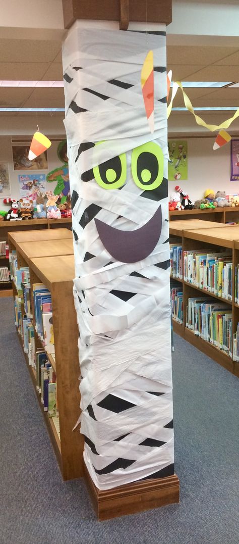 Ghostly Halloween column Halloween Media Center Decor, School Library Halloween Decorations, Back To School Displays Library, Halloween Library Door Decorations, Library Haunted House, Thanksgiving Decorations For School Library, Halloween Book Displays Library, October Library Book Displays, Spooky Library Displays