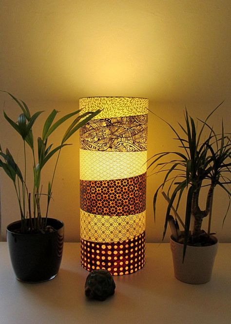 These Japanese lamps made with rice paper provide a typical atmosphere in your home as well as lighting for both light source and serenity. Japanese decor is not necessarily required in every room. You can restrict it to a room like the living room, the bedroom or the entrance only. #bedroomdecor #bedside #diylighting #handmadelighting #lantern #lampshade #lightingdesign #modernlighting #outdoorlighting #tablelamp #woodlamp #woodworking Japanese Lampshade, Pretty Lamps, Lantern Lampshade, Japanese Lamp, Diy Table Lamp, Asian Lamps, Japanese Lamps, Repurposed Lamp, Wooden Table Lamp