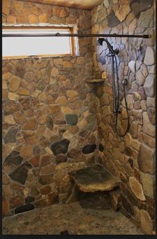 Marble Tile Bathroom Wall, Cabin Shower Ideas, Rock Bathroom Ideas, Rustic Showers, Stone Shower Walls, River Houses, Rustic Bathroom Shower, Rock Shower, Metal Building Designs