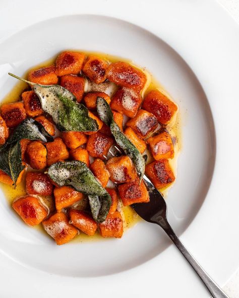 Crispy sweet potato gnocchi on a white plate with a brown butter sauce and crispy sage leaves. Fork resting in. Butternut Squash Gnocchi, Squash Gnocchi, Pasta Board, Making Gnocchi, Emily Ann, Sweet Potato Gnocchi, Crispy Sweet Potato, Homemade Gnocchi, Potato Gnocchi