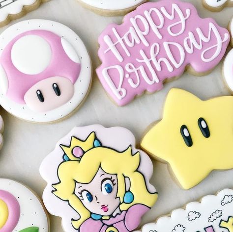 Lauren Wegner | Shreveport, LA Cookie Artist on Instagram: "Can you hear the music?🎵🎶 I used to play a lot of Super Mario as a kid, so this set had me feeling some serious nostalgia. 😄 I loved putting a girly spin on this classic video game. And of course we couldn’t leave out Princess Peach! My books are open for March and April! I also have limited availability for February 25. Message me for details! #princesspeachcookies #princesspeach #supermario #supermariocookies #birthdaycookies #numb Princess Peach And Bowser Cake, Princess Peach Food Ideas, Mario And Peach Party, Princess Peach Sugar Cookies, Girly Mario Birthday, Princess Peach Cookies Decorated, Super Mario And Princess Peach Party, Super Mario Girl Birthday Party, Mario Birthday Party Girl