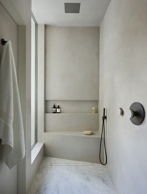 This walk-in shower is part of a whole house refurbishment which interior designer Sophie Roussel describes as having, “A great sense of Zen and comfort”. ‘Elements’ brassware from The Watermark Collection was specified throughout the bathrooms and kitchen. Inspired by spas in Marrakech, the bathrooms feature Tadelakt, a concrete finish with an extraordinary polished plaster texture.  It forms the perfect minimalist background for brassware from The Watermark Collection’s ‘Elements’ collection. Venetian Plastering, Decor Ikea, Interior Minimalista, Bathroom Shower Tile, Bathroom Trends, Bath Room, Minimalist Bathroom, Wet Rooms, Shower Design