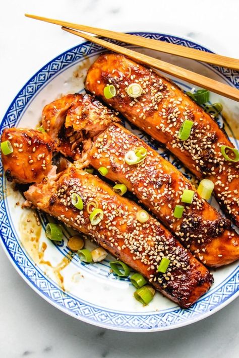 You’ll love this Air Fryer Salmon Teriyaki Recipe that cooks in under 8 minutes! The air fried salmon comes out perfectly juicy tender with a sweet caramelized keto teriyaki sauce crust on top. Pair it with shirataki fried rice and a big bowl of spicy Asian greens for an easy and delicious weeknight meal! Paleo Kale Salad, Salmon Recipe Air Fryer, Honey Teriyaki Salmon, Whole30 Salmon Recipes, Salmon Air Fryer, Keto Teriyaki, Air Fried Salmon, Salmon In Air Fryer, Paleo Salmon Cakes