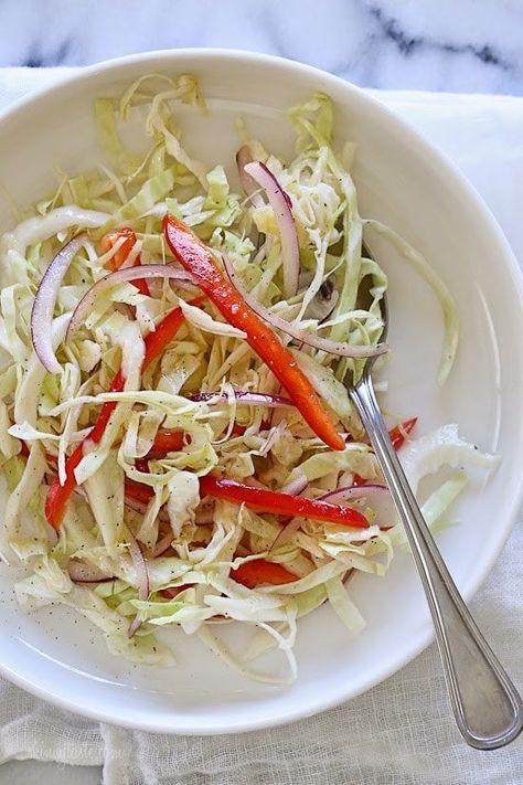 This quick, simple slaw is a staple in my house. Perfect when you need something acidic to balance a savory dish. Everyone loves this, including my toddler only for her I leave out the red onion. It's also low-carb, vegetarian, gluten-free and whole30 compliant. Quick Healthy Side Dishes, Slaw Recipe, Skinnytaste Recipes, Cabbage Slaw, Skinny Taste Recipes, Weight Watcher Recipes, Food Tasting, Healthy Side Dishes, Veggie Sides