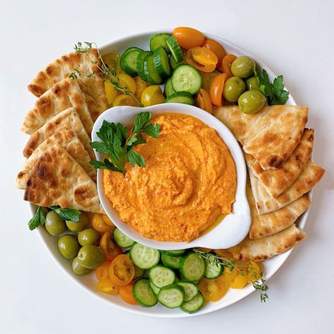 An homage to the Greek dish Htipiti, this whipped feta dip with roasted red peppers is the perfect balance of tangy and savory. With only five main ingredients, this simple dip is easy to make for any small gathering as an appetizer! Try pairing this with toasted pita, fresh crudités, and marinated olives. Red Pepper Recipes, Roasted Red Pepper Dip, Red Pepper Dip, Stuffed Pepper Dip, Marinated Olives, Spiced Pecans, Feta Dip, Whipped Feta, Greek Dishes