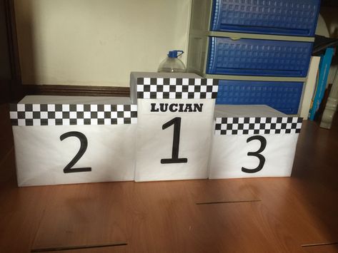 Diy box podium stand for cakes and pastries race car theme birthday Diy Podium Stand, Indy Decor, Diy Podium, Podium Diy, F1 Birthday, Cars Preschool, Car Theme Birthday, Derby Decor, Boy 16th Birthday