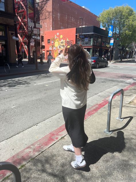 Women with long brown hair with long black dress cream sweater and white adidas sambas with bow socks Black Dress And Sneakers, Sambas White, Sambas Outfits, Portugal Fits, Sambas Outfit, Adidas Samba White, Sambas Adidas, Samba Dress, Dress And Sneakers