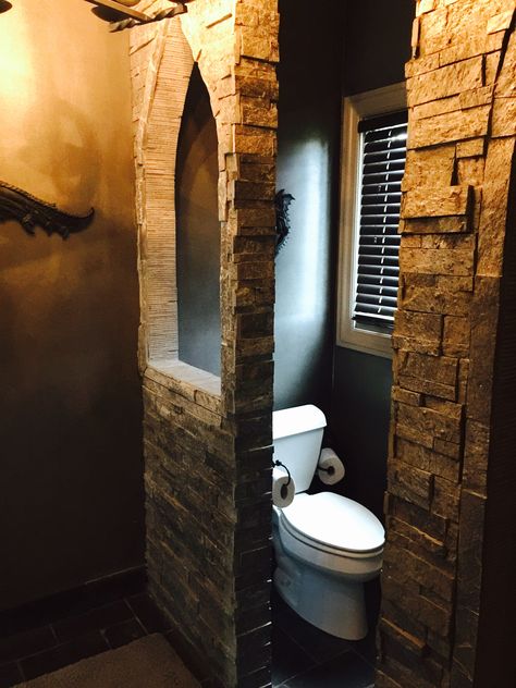 Hidden toilet area in our main floor guest old world castle bathroom with stone archway cutout Castle Toilet, Toilet In Bathroom, Castle Bathroom, Bathroom With Stone, Old World Bathroom, Magical Bathroom, Kitchen Bar Lighting, Hidden Toilet, Stone Archway