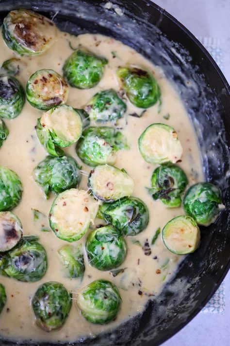 Creamy Garlic Brussels Sprouts (No Bacon) - Cooked by Julie Brussel Sprout Recipes Creamy, Creamy Brussels Sprouts With Bacon, Creamed Brussel Sprouts With Bacon, Creamed Brussel Sprouts, Creamy Brussel Sprouts Bacon, Creamy Garlic Brussel Sprouts With Bacon, Cream Cheese Brussel Sprouts, Campbells Creamy Brussel Sprouts Bacon, Leftover Brussel Sprouts