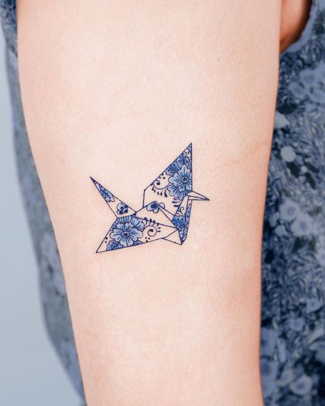 porcelain paper crane 🦩 Thank you :) @studiobysol @e.nal.tattoo Blue Crane Tattoo, Porcelain Style Tattoo, Small Crane Tattoo, Fine China Tattoo, Paper Crane Tattoo Minimalist, Blue Porcelain Tattoo, Fine Line Paper Crane Tattoo, Porcelain Tattoo, Origami Paper Crane Tattoo