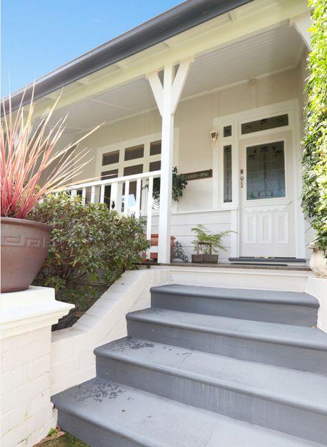 The Roof, gutters, front steps and barge boards are all Ironstone (which is a Colorbond Colour) the walls are Dulux Sago and the batons, verandah posts, balusters and top rails and the window frames are Dulux Antique White USA. Ironstone Roof Colour Schemes, Queenslander Facade, External Steps, Carport House, White Weatherboard House, Contemporary Paint Colors, Barge Boards, Terrace Exterior, Exterior House Colours