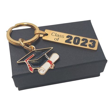 Have a friend or family member graduating this year? Looking for a gift for the graduate for their graduation, well look no further. This simple keychain is so beautiful in person and will make a nice addition to the car keys ring, duffle bag, backpack or purse.  This keychain is made of stainless steel and engraved with your choice of year: -  Class of 2022 -  Class of 2023 -  Class of 2024 (use drop down to select) - new photo of 2024 will be added soon Gold plated stainless steel with a high Keys Ring, Graduation Cap And Diploma, Simple Keychain, Cap And Diploma, White Keychain, Gift For Graduate, Graduation Keychain, Gold Keychain, Senior Gifts