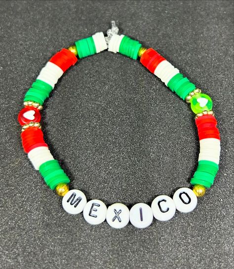 Mexico 🇲🇽 (Country) Heishi Bracelet #handmadebracelet #heishibracelets #beadedbracelets #bracelets #mexico #mexicocity #mexico🇲🇽 #mexciolife #mexicobracelet #mexicojewelry #mexicobracelets Mexican Bracelets Handmade Beads, Mexico Bracelets, Mexico Beaded Bracelets, Red Mexican Bracelet, Mexican Protection Bracelet, Mexico Country, Friendship Bracelets With Beads, Clay Bracelet, Bracelet Designs