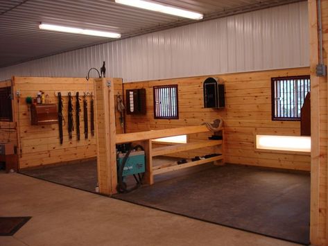 I like this organization and amount of storage for these wash stalls! ...though I think I would change a couple things like I wouldn't have girths hanging on the wall. I like the hooks to hang bridles or whatever though. I love the saddle rack with shelves as the divider and love having so much space for polos and bell boots! Horse Stables Design, Dream Barn Stables, Horse Tack Rooms, Barn Layout, Equestrian Building, Horse Barn Ideas Stables, Barn Stalls, Horse Barn Designs, Dream Stables