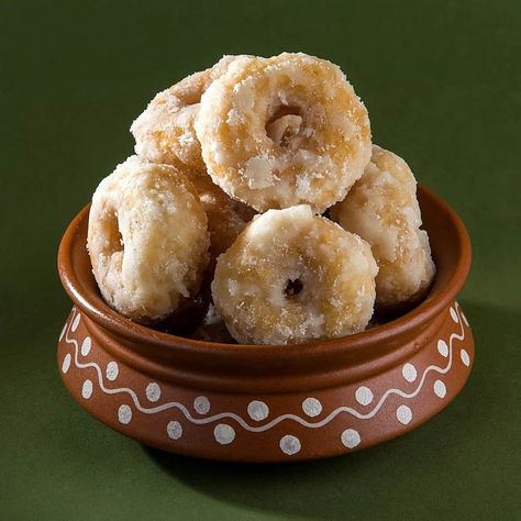 A traditional sweet of deep fried leavened dough coated in sugar syrup. balushahi is a famous North Indian sweet. In south India, the same sweet is called as badusha or badhusha. In all mithai shops you can easily get balushahi or badusha. Balushahi are also called as Indian doughnuts. but the taste and texture of balushahi is way different from doughnuts. While a doughnut has a light and fluffy texture, balushahi is not fluffy. It has a soft and slight flaky texture. A doughnut has a soft textu Bangladeshi Sweets, Balushahi Recipe, Khasta Kachori, Sweet Restaurant, Kachori Recipe, Garam Masala Powder, Deep Fried Food, Tamarind Chutney, Fluffy Texture