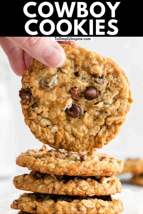 Cowboy Cookies, aka Ranger Cookies, are a hearty yet soft and chewy oatmeal cookies with some nutty crunch, ooey-gooey chocolate chips, flakes of coconut, and fully loaded with flavor! Best Cowboy Cookies, Cookies Cowboy, Cowboy Cookies Recipe, Soft And Chewy Oatmeal Cookies, Cowboy Cookie, Ranger Cookies, Cowboy Cookie Recipe, Chewy Oatmeal Cookies, Apple Oatmeal Cookies